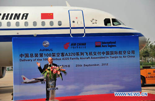 An official of Airbus speaks at the delivery ceremony in Tianjin, north China, Sept. 25, 2012. A ceremony of the delivery of the 100th Airbus A320 family aircraft assembled in Tianjin to Air China was held here on Tuesday. (Xinhua/Liu Haifeng) 