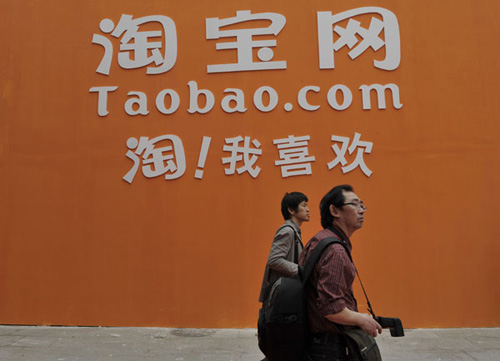 A Taobao.com billboard at an auto show in Beijing. The Hangzhou-based website has become the biggest online trading platform in China as well as the most important platform for thousands of online entrepreneurs. [Photo by An Xin / For China Daily]