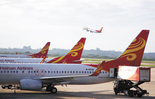 Hainan Airlines Co Ltd aircraft at Haikou Meilan International Airport in Haikou, Hainan province. The acquisition of Aigle Azur by HNA Group, the parent company of Hainan Airlines, marks the first time a Chinese carrier has invested in a European airline. [Photo/China Daily] 