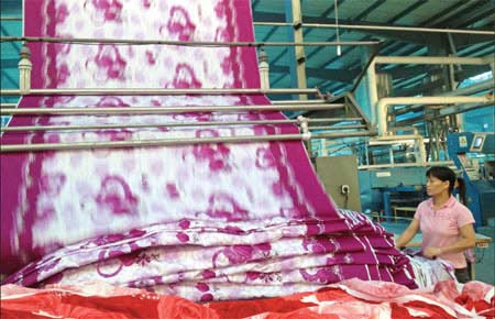 Jishan Dyeing Plant has adopted advanced printing technology to reduce environmental pollution. Yan Yiqi / China Daily
