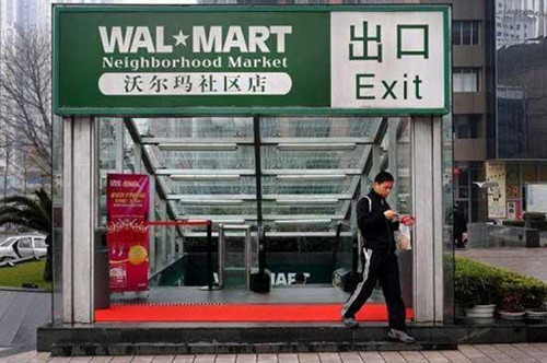 A man walks out of a Wal Mart outlet in Shenzhen. China said Tuesday it has approved a plan by Wal-Mart Stores Inc. to gain control of a local online supermarket. 