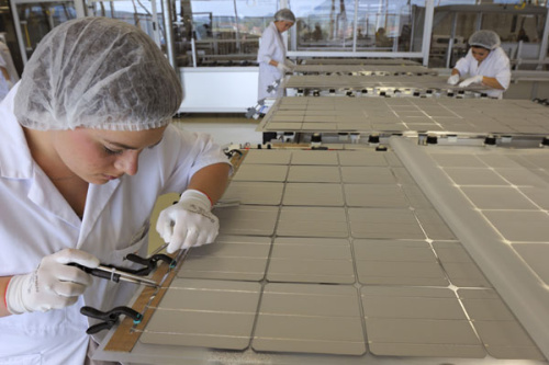 Workers assemble solar panels in a factory in Sainte-Marguerite, France. China has filed a complaint to the World Trade Organization about the subsidies offered to solar panel makers by some European Union countries. [Photo/Agencies]