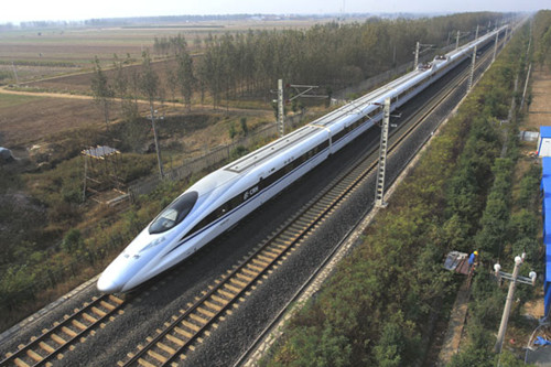 A high-speed train passes through Weifang, Shandong province. Chinese infrastructure companies have already completed projects in developing economies, such as Algeria, Libya and Nigeria. JIAO HONGTAO / FOR CHINA DAILY