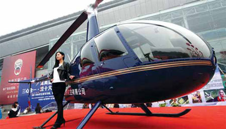Private helicopter on display at a recent housing fair. Industry insiders say buyers of private aircraft should have minimum assets of 100 million yuan. E Guoqing / for China Daily 