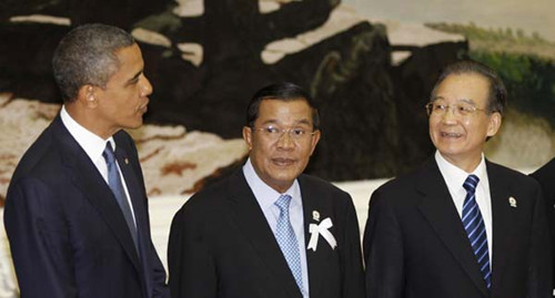 US President Barack Obama chats with Cambodian Prime Minister Hun Sen and Premier Wen Jiabao during the 7th East Asia Summit Plenary Session in Phnom Penh, Cambodia, on Tuesday. Vincent Thian / Associated Press 