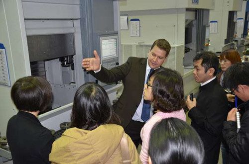 A group of Chinese visitors taking a tour at Emag factory in Stuttgart, Germany. Emag is a leading global vertical pick-up turning machine manufacturer. The company is a major supplier of Chinese steel giant Baosteel Group. Provided to China Daily 