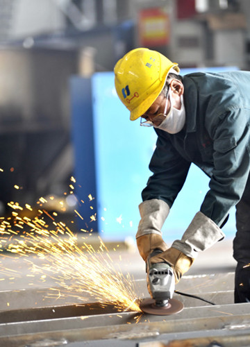 Infrastructure development is sparking an upturn in the economy at Caofeidian, an emerging industrial zone in Hebei province.[Photo/Xinhua]