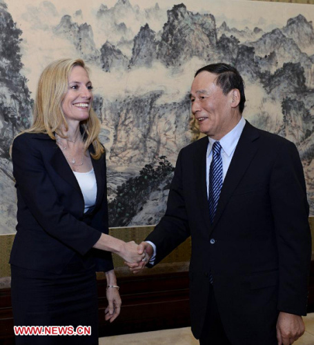 Chinese Vice Premier Wang Qishan (R) meets with the U.S. Treasury's Under Secretary for International Affairs Lael Brainard in Beijing, capital of China, Dec. 11, 2012. Lael Brainard was commissioned by U.S. Treasury Secretary Timothy Geithner for her visit. (Xinhua/Rao Aimin)