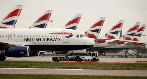 British Airways planes at Heathrow Airport in London. The carrier will run three flights weekly on a new Chengdu-London route, using Boeing 777 airplanes with four cabins. [Oli Scarff / Getty Images]