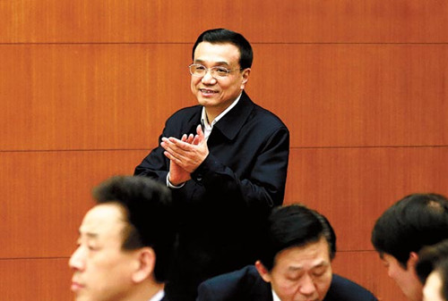 Vice-Premier Li Keqiang arrives at a meeting to address reform measures in Beijing on Wednesday. [Feng Yongbin / China Daily]