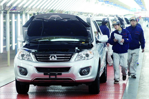 Quality control employees conduct a final inspection at Great Wall Motors Co Ltd's assembly plant in Tianjin. Chinese automobiles hold a 12 percent share of the Chilean market, according to Yang Wanming, Chinese ambassador to Chile. [Photo / China Daily]