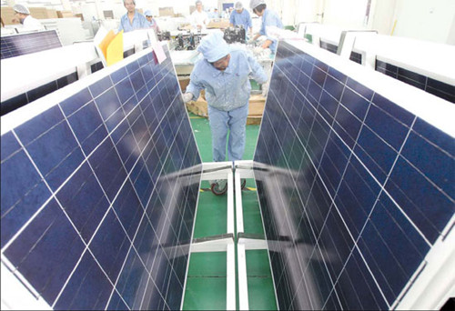 Workers checking the quality of solar panels at a PV solar factory in Jiangsu province. For the Chinese solar industry, the path to its largest overseas market - Europe - is increasingly narrowing because the European Union has started anti-dumping and anti-subsidy investigations on made-in-China solar products. Provided to China Daily