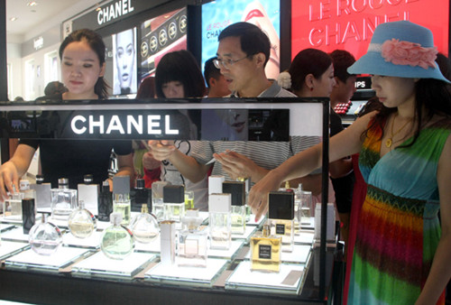 Customers at a duty-free shop in Sanya, Hainan province. Chanel China said the prices of some of its products sold on the mainland will be raised on Tuesday or Wednesday. Sun Qing / For China Daily