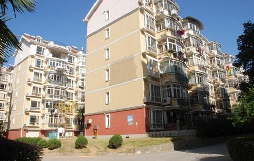 China may postpone expanding its trial property tax across the country, a senior tax official said in a media report published on Monday.