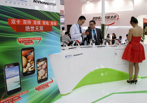 Lenovo Group's smartphone stand at a trade show in Beijing. The electronics giant, which is already a major player in the smartphone and personal computer sectors, is in the final stage of talks to buy a TV plant from Sharp Corp. [Photo / China Daily] 