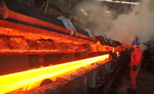 A production line at a steel mill in Dalian, Liaoning province. China's steel industry will continue to face overcapacity problems after seeing a dramatic decline in profits in 2012, the industry association said on Thursday. [Photo / China Daily]