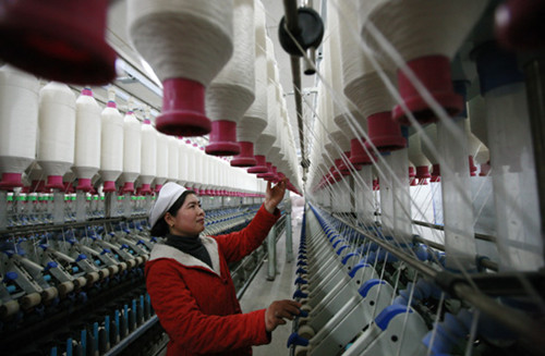 A textile mill, whose products are mainly for export, in Huaibei, Anhui province. Many of the country's provinces have set lower foreign trade targets for this year due to sluggish global demand and the unfavorable trade environment. [Photo/China Daily]