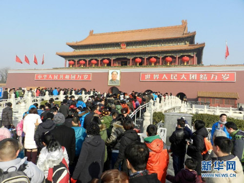 Photo taken on Feb. 12 shows tourists walking into the Gate of Heavenly Peace in Beijing. According to the statistics issued on Feb. 15, by the national holiday tourism office for coordination meeting of inter-ministry and department, the totoal number of