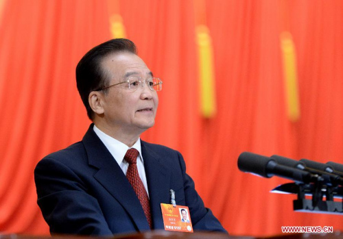 Chinese Premier Wen Jiabao delivers the government work report during the opening meeting of the first session of the 12th National People's Congress (NPC) at the Great Hall of the People in Beijing, capital of China, March 5, 2013. (Xinhua/Huang Jingwen)