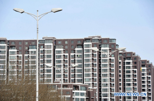 Photo taken on March 18, 2013 shows commercial apartment buildings in Yinchuan, capital of northwest China's Ningxia Hui Autonomous Region.  (Xinhua/Peng Zhaozhi)