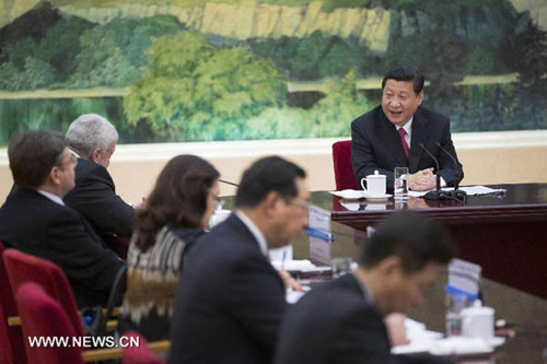 Chinese President Xi Jinping (R) answers questions at a joint interview in Beijing, capital of China, March 19, 2013.(Xinhua/Lan Hongguang)