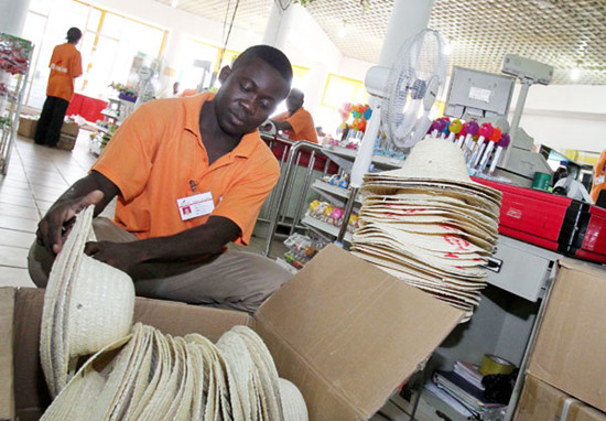 A salesman checks goods at a Chinese supermarket in Brazzaville, capital of Republic of the Congo. Meng Chenguang / Xinhua