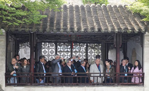Foreign guests for the fourth China-Europe High-Level Political Party Forum visit Lingering Garden, a classical Suzhou-style garden located in Suzhou, Jiangsu province, on Monday. Xu Jingxing/China Daily