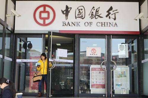 A Bank of China branch in Beijing. Banks brought in nearly 236.3 billion yuan ($38.25 billion) worth of foreign exchange in March on a net basis, boosting the total yuan holdings for purchasing foreign currency to nearly 27.1 trillion yuan. [Zhu Xingxin/for China Daily] 