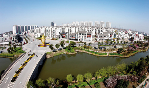 A view of Yonglian village, in Zhangjiagang, Jiangsu province, in March. The village was considered one of the province's poorest and most underdeveloped before economic reforms and opening-up, but has now become a model example of the country's urbanization program. [Photo/Xinhua]