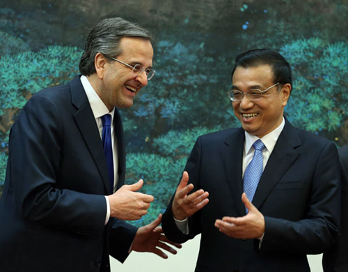 Premier Li Keqiang meets visiting Greek Prime Minister Antonis Samaras in Beijing on Thursday. The two leaders presided over the signing of a series of cooperation documents in sectors including investments, shipping and agriculture. Wu Zhiyi/China Daily