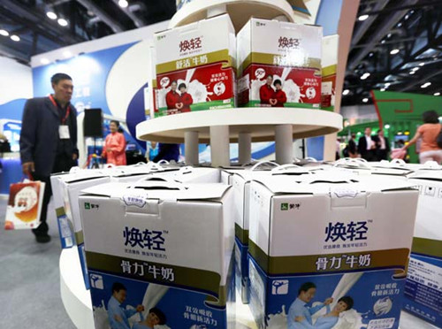 Mengniu Dairy Co Ltd's milk products at a trade show in Beijing on May 1. [Photo/Provided to China Daily]