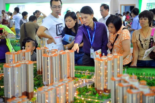 Models of residential property on display in Guangzhou. [Photo/China Daily]
