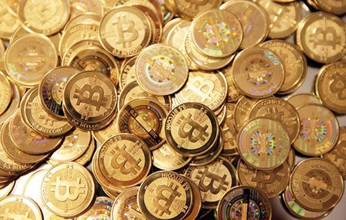 A pile of newly minted bitcoins arranged for a photograph in Sandy, Utah, in the United States. Created four years ago by a person or group using the name Satoshi Nakamoto, bitcoins are a virtual currency that can be used to buy and sell a broad range of items - from cupcakes to electronics. People can also pay with bitcoins in various coffee shops, phone and computer stores and bookstores in big Chinese cities including Beijing and Shanghai. [Provided to China Daily]