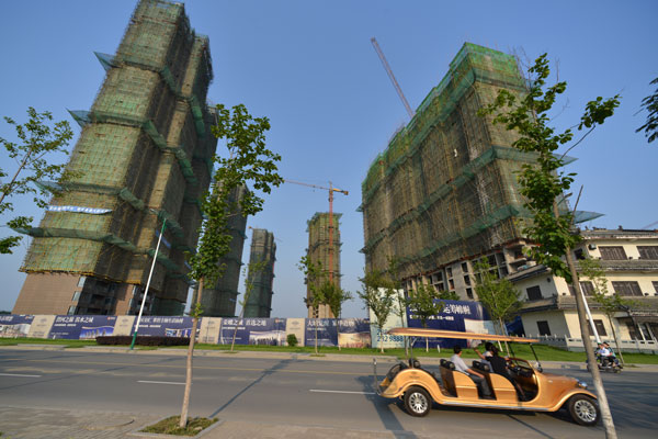 A housing project under construction in Liuan, Anhui province. Home prices continue to rise in China's major cities but at a slower pace, according to the National Bureau of Statistics. ZHENG JINQIANG/FOR CHINA DAILY 