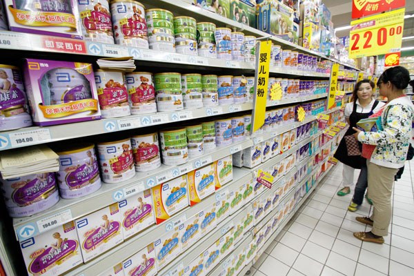 A woman shops for baby formula at a supermarket in Nanjing, Jiangsu province, this month. PROVIDED TO CHINA DAILY 