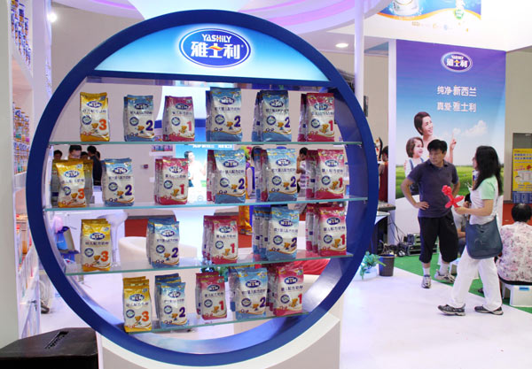 Yashili milk formula products at an expo in Beijing in July. Yashili was ranked eighth in China's milk formula market and had a growth rate of 35.8 percent last year. [Photo/Provided to China Daily]