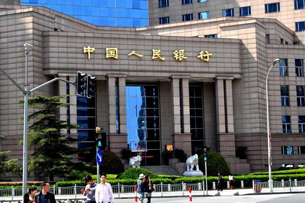 The Shanghai headquarters of the People's Bank of China. The central bank said on Tuesday that it has boosted liquidity support to cautious financial institutions, and added that the credit crunch in the country's interbank market will gradually ease. YAN DAMING/FOR CHINA DAILY