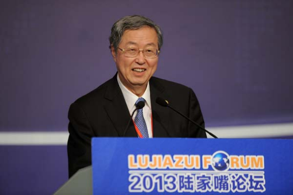 Zhou Xiaochuan, governor of the People's Bank of China, speaks at the Lujiazui Forum in Shanghai on Friday. He said the central bank will direct banks to release reasonable lending and will adjust liquidity at appropriate times. LIU XIN / FOR CHINA DAILY 