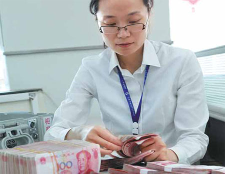 The amount of yuan used for foreign exchange purchases by financial institutions, an indicator of capital flows, declined to 27.39 trillion yuan last month, the first drop in seven months, the central bank said. Si Wei / for China Daily