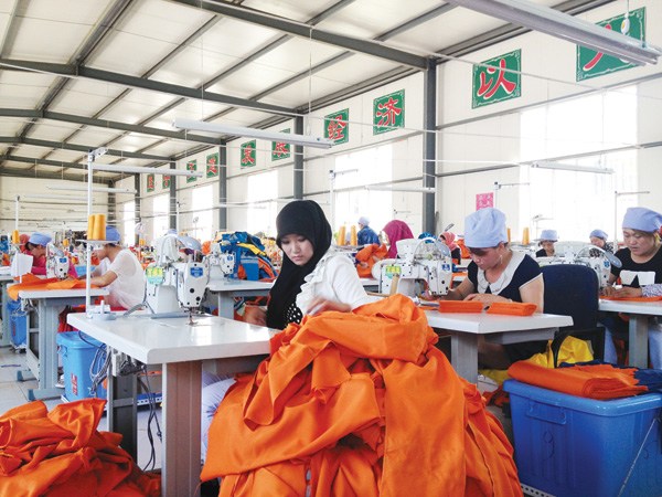 Workers make clothes at Yinchuan Wantini Clothing Co Ltd.