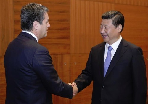 Chinese President Xi Jinping (R) meets with Roberto Azevedo, director-general of the World Trade Organization (WTO), in St. Petersburg, Russia, Sept. 5, 2013. (Xinhua/Ding Lin)