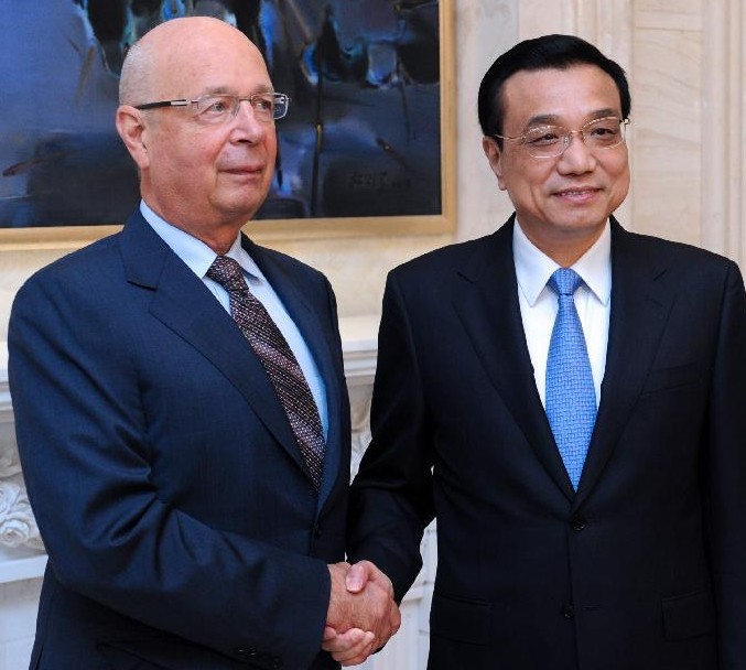 Chinese Premier Li Keqiang (R) shakes hands with Klaus Schwab, Executive Chairman of the World Economic Forum, during their meeting in Dalian, northeast China's Liaoning Province, Sept. 9, 2013. (Xinhua/Zhang Duo)