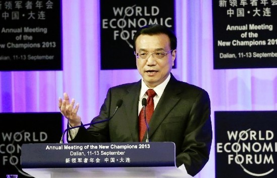 Chinese Premier Li Keqiang addresses the opening ceremony of the Annual Meeting of the New Champions 2013, also known as Summer Davos, in Dalian, northeast China's Liaoning Province, Sept. 11, 2013. The three-day Summer Davos opened here on Wednesday. (Xinhua/Zhang Duo)