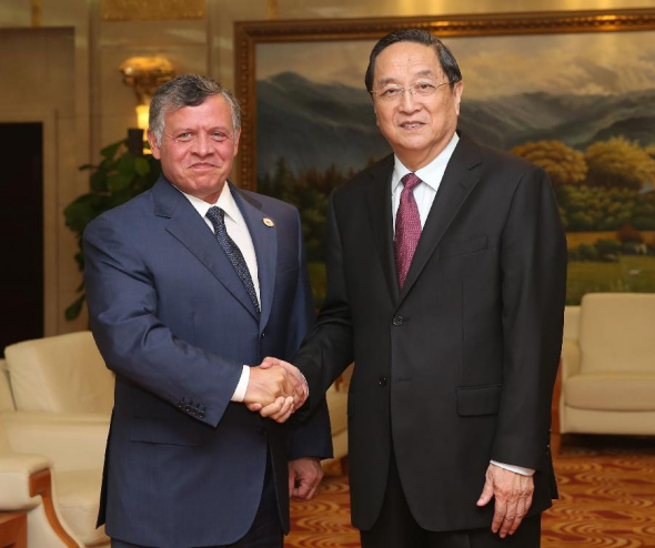 Yu Zhengsheng (R), chairman of the National Committee of the Chinese People's Political Consultative Conference, shakes hands with King of Jordan Abdullah II ibn Al-Hussein prior to their meeting on the sidelines of China-Arab State Expo in Yinchuan, capital of northwest China's Ningxia Hui Autonomous Region, Sept. 15, 2013. (Xinhua/Liu Weibing) 