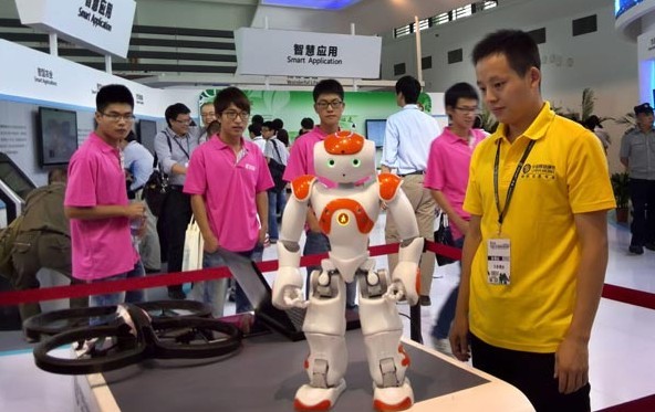 An exhibitor shows a robot at the Smart City Expo China 2013 in Ningbo, Zhejiang province, on Sept 6. Hu Xuejun/For China Daily
