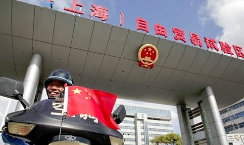 A motorbike rider passes the No. 3 gate of the China (Shanghai) Pilot Free Trade Zone (FTZ) in Shanghai on Friday. Photo: Cai Xianmin/GT