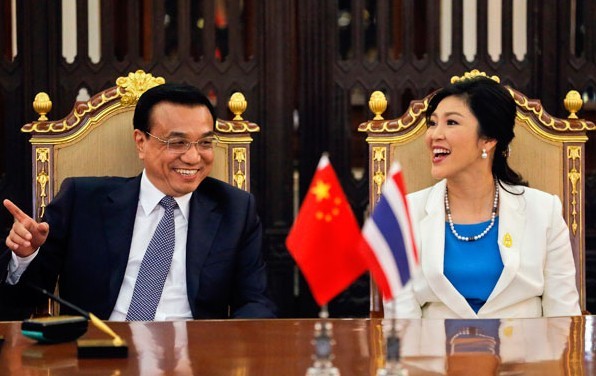 Premier Li Keqiang and Thai Prime Minister Yingluck Shinawatra chat during their meeting at Government House in Bangkok on Friday. Damir Sagolj / Reuters