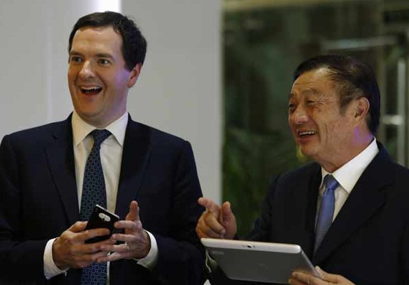 British Chancellor of the Exchequer George Osborne (left) and Huawei CEO and founder Ren Zhengfei talk at Huawei's headquarters in Shenzhen on Wednesday. Provided to China Daily