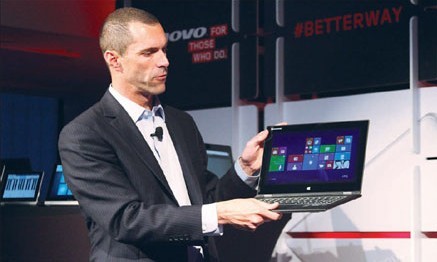 Jay Parker, president of Lenovo's North American operations, talking about the company's multimode devices at a preview launch event where the company's new Yoga tablet made its debut. Amy He / China Daily  