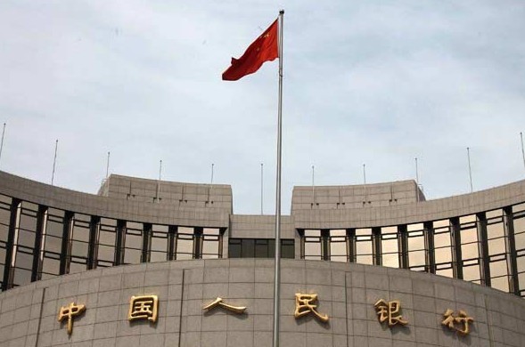 The headquarters of the People's Bank of China in Beijing. Central bank Governor Zhou Xiaochuan said China will speed up the process for the yuan to become fully convertible. Jing Wei / For China Daily  